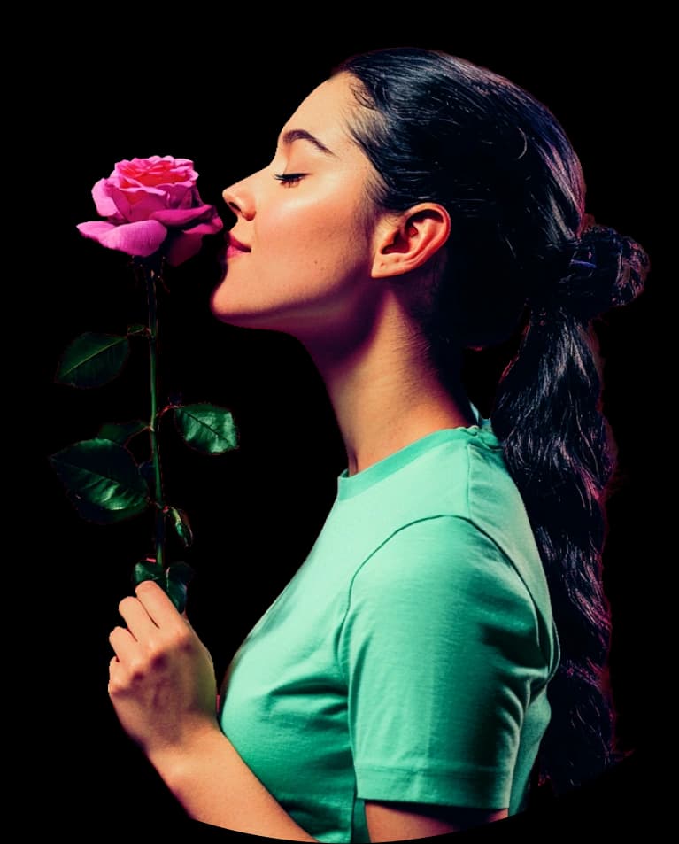 Woman holding a rose to her nose